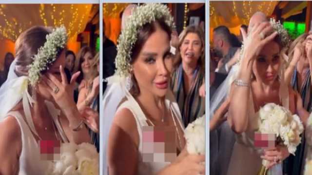 مذيعة لبنانية تحتفل بزفافها بدون العريس لدواعي أمنية..فيديو ! اخر خبر