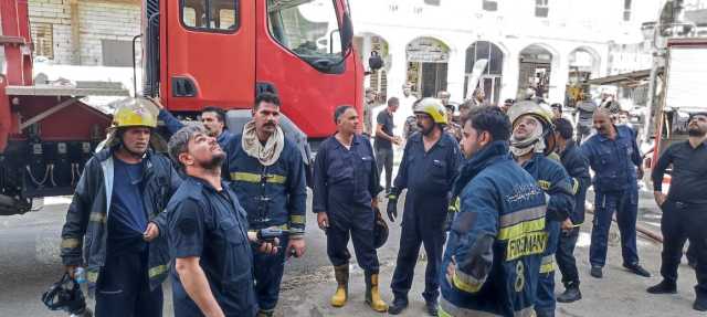 إنقاذ 20 نزيلاً مع حالات اختناق جراء حريق في فندق وسط النجف.. صور وفيديو